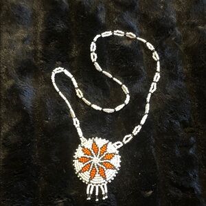 Handcrafted Beaded Necklace with Orange and White Design